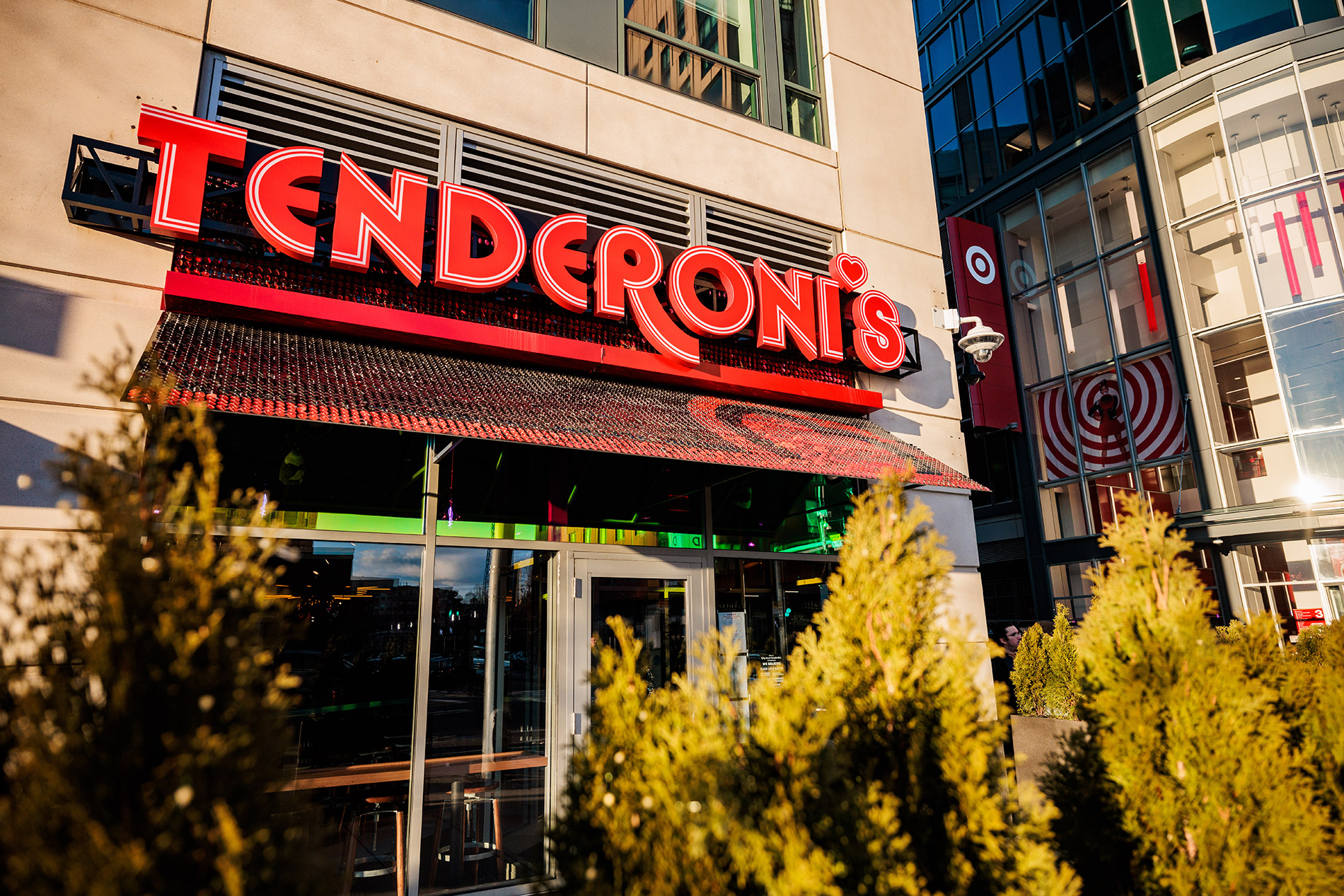 An exterior view of a restaurant with a sign that says tenderoni's.